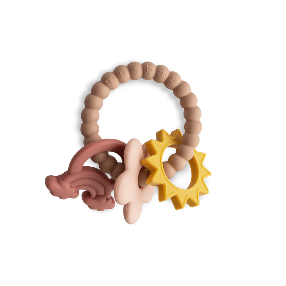 Teething ring with star and curved designs in pink, beige, and yellow on a white background