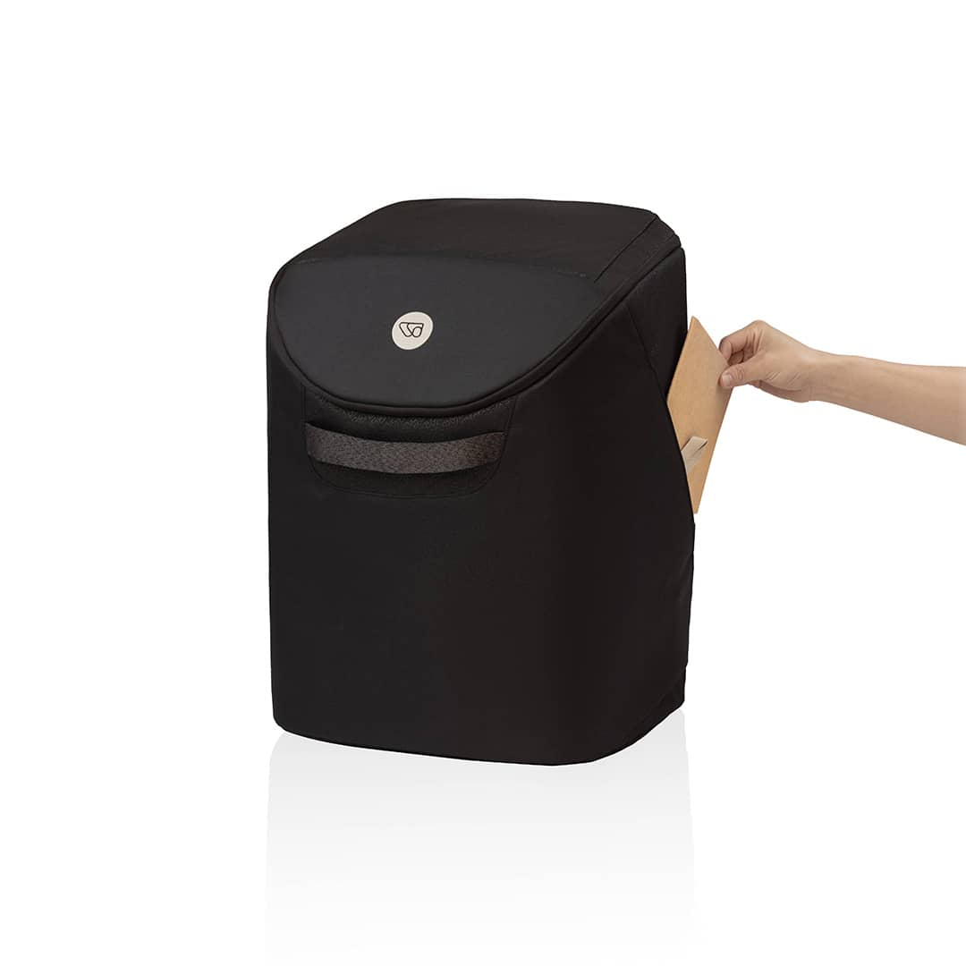Black trash can with a hand opening it on a white background