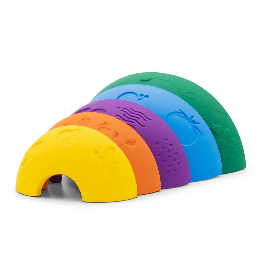 Colorful rubber duck toy with arch-shaped body on a white background