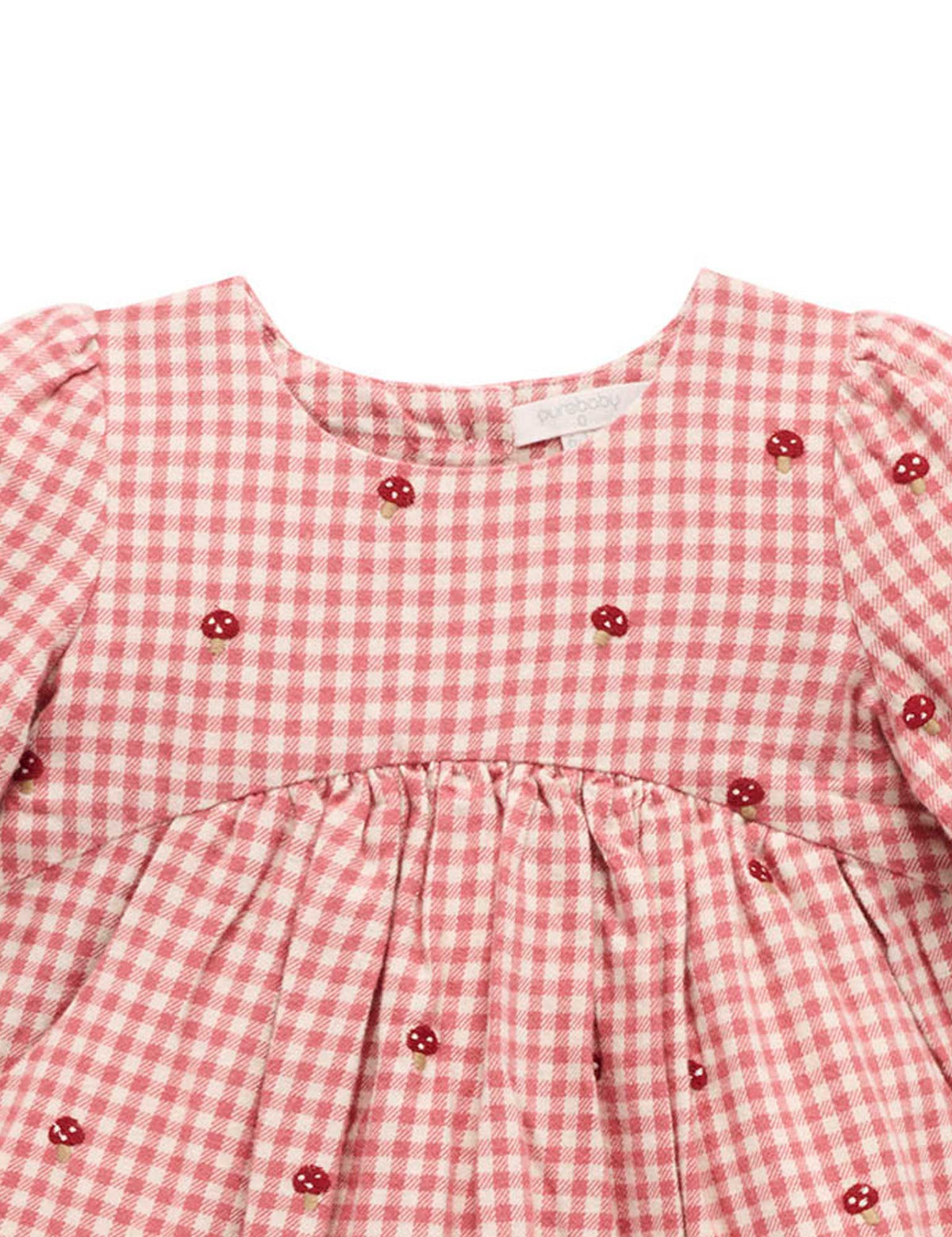 Red and white checkered dress with button details on a white background