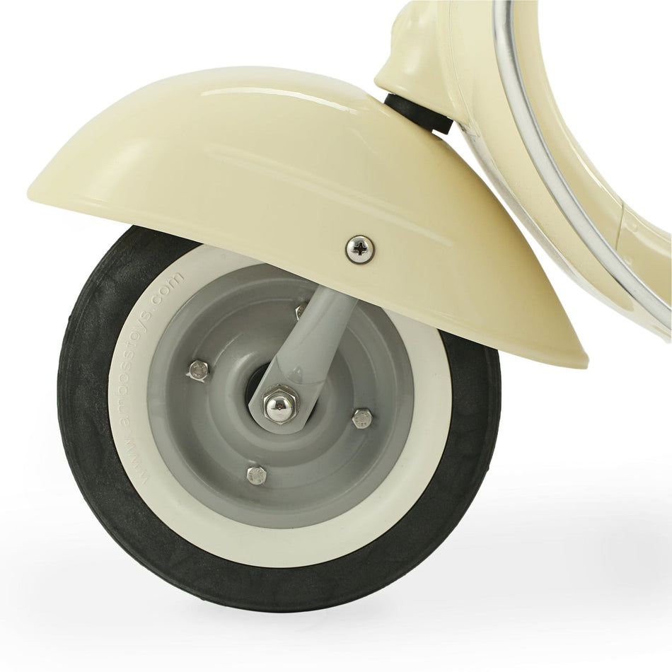Close-up of a scooter wheel with cream fender on a white background