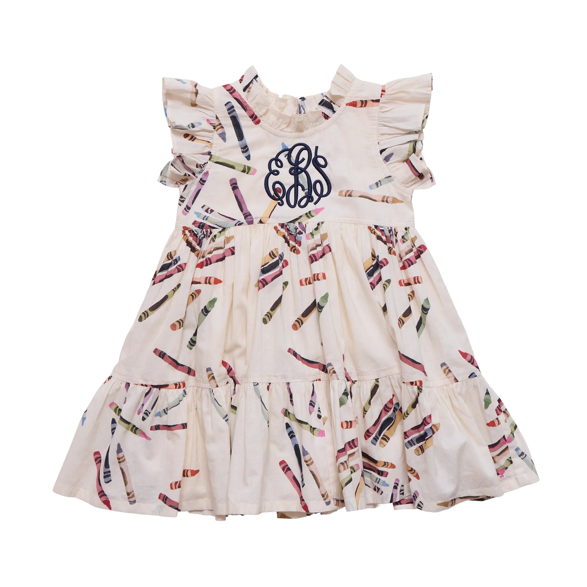 A sleeveless tiered baby dress in cream with a colorful crayon print and a navy blue monogram on the chest, shown against a plain white background.