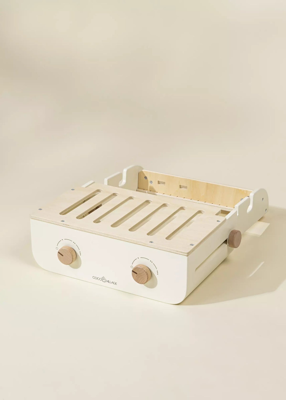 Wooden tray with white base on a beige background