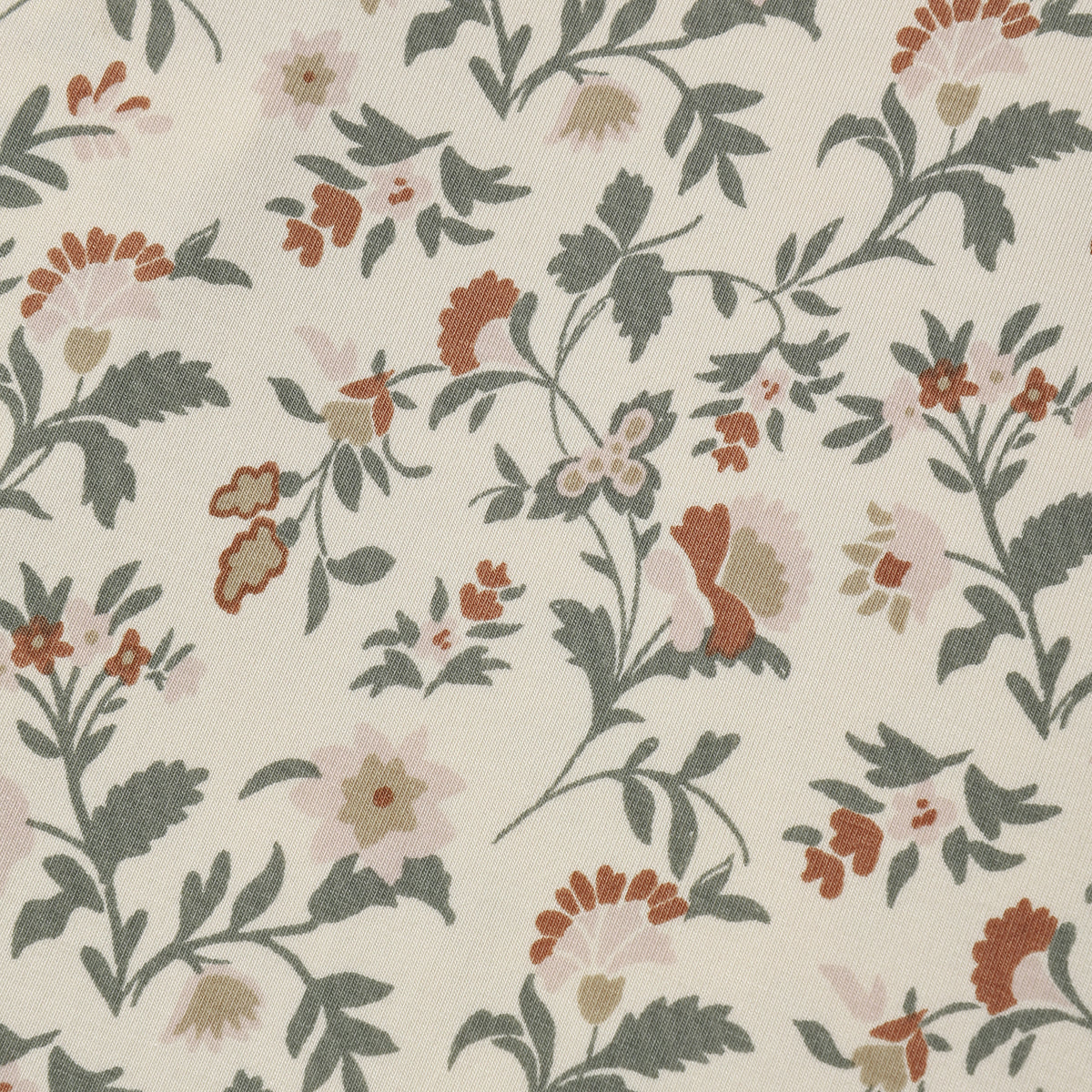 Close-up of the holiday floral fabric pattern by Quincy Mae.