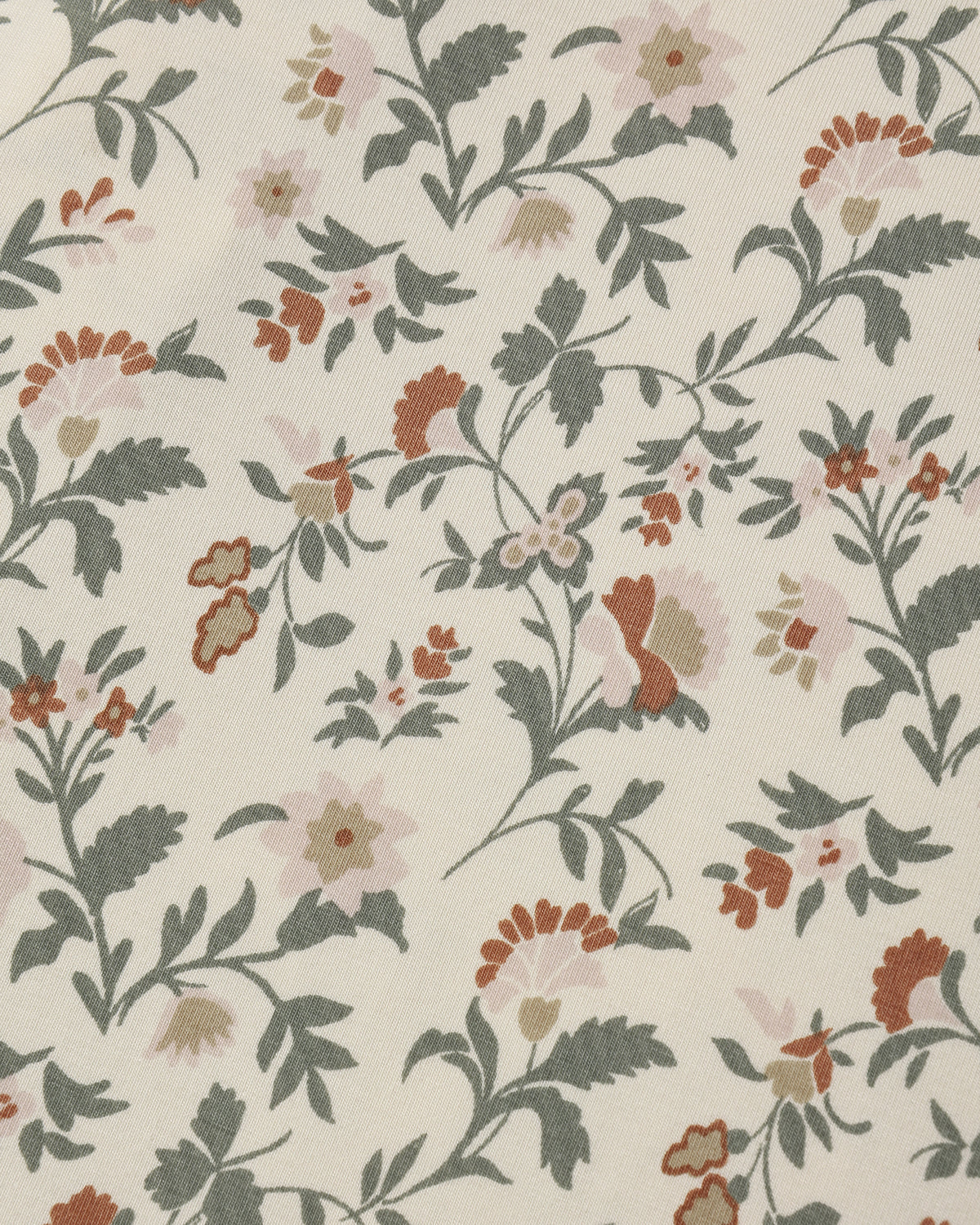 Close-up of the holiday floral fabric pattern by Quincy Mae.