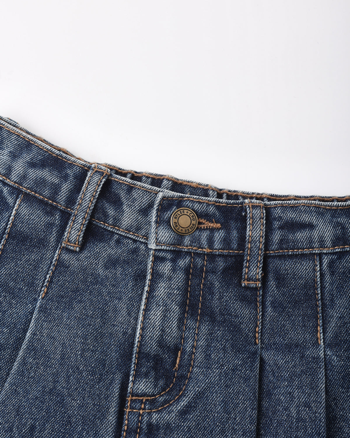Close-up of dark blue denim jeans showing the waistband, belt loops, button closure, and front pocket stitching on a plain white background.