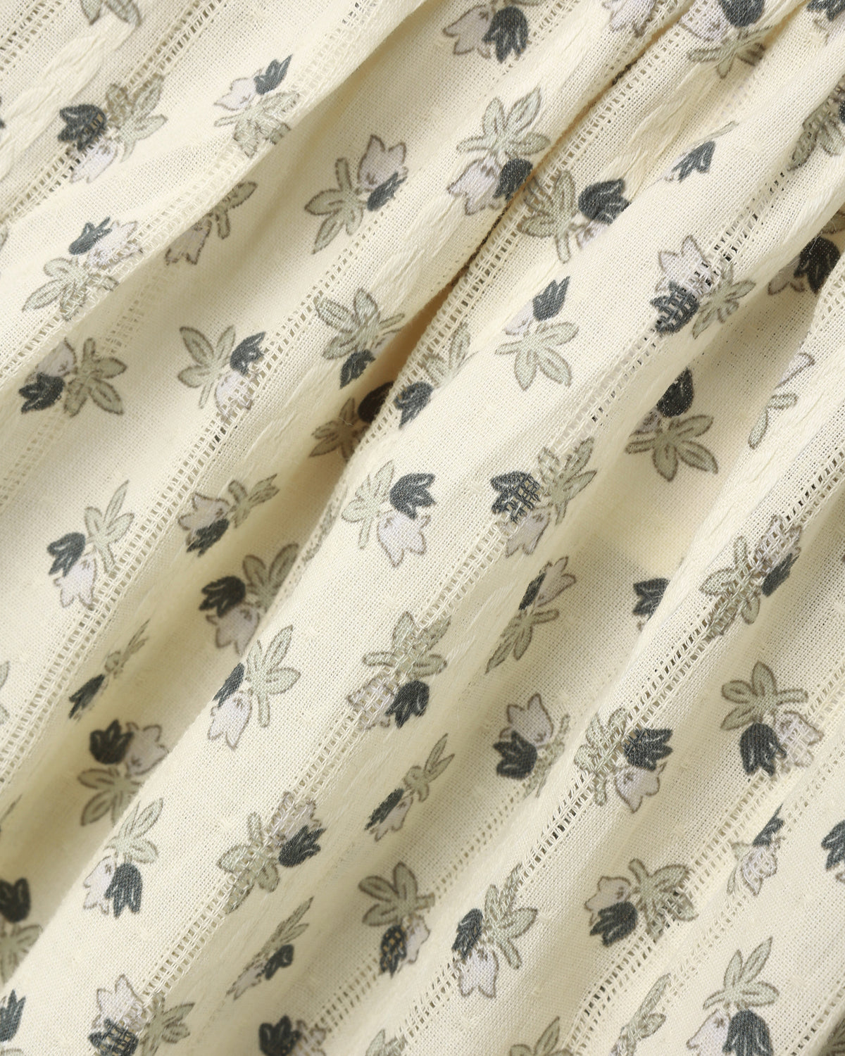 A cream-colored with a small floral pattern.