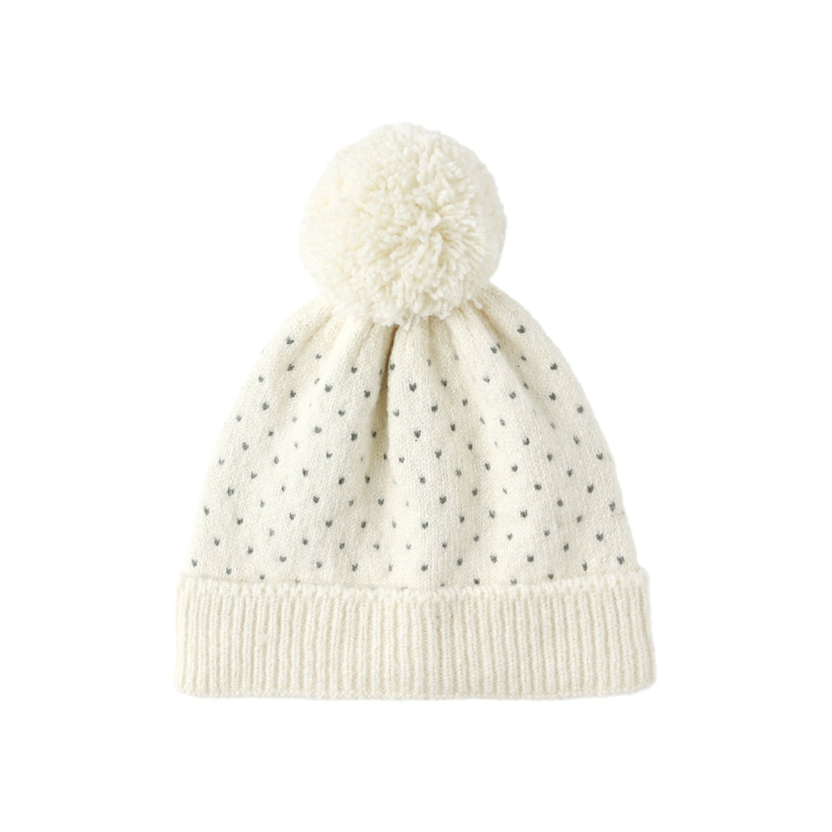 An off-white knit pom-pom beanie with a small black polka dot pattern and a ribbed brim, shown against a plain white background.