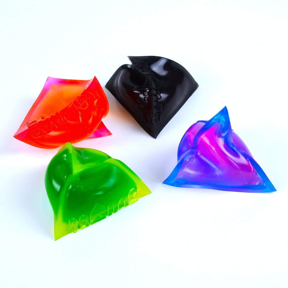 Four colorful triangular objects on a white background