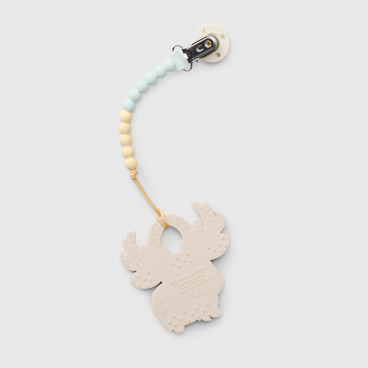 A baby teething ring clip with a light beige wooden reindeer-shaped ring, a light blue and cream beaded strap, and a black plastic clip, shown on a light gray background.