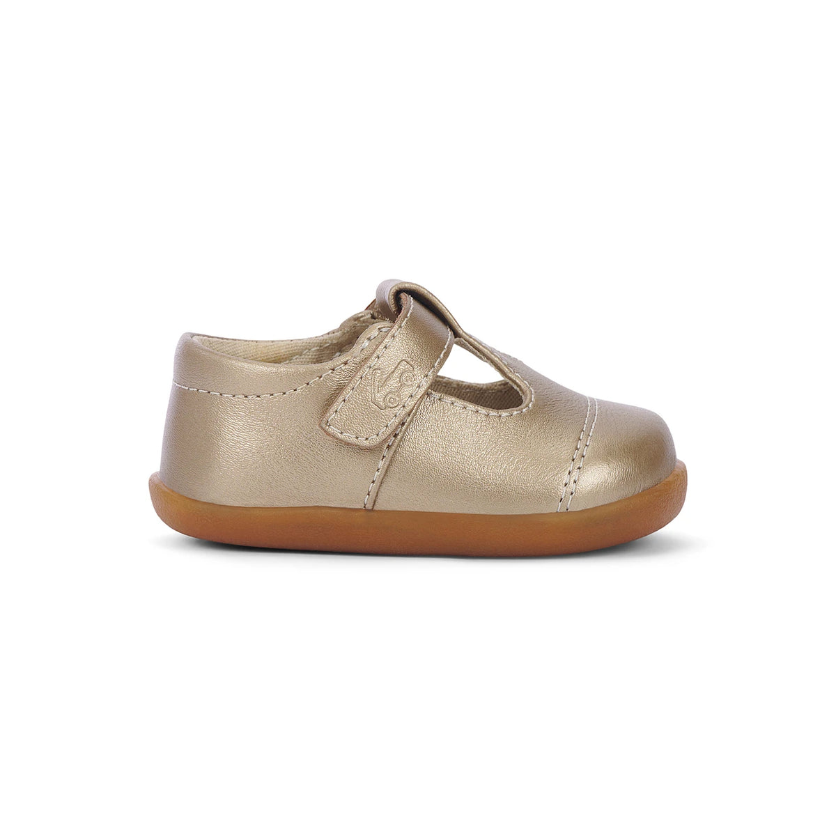 A single metallic gold baby Mary Jane shoe with a brown gum sole, shown from a side profile on a white background.