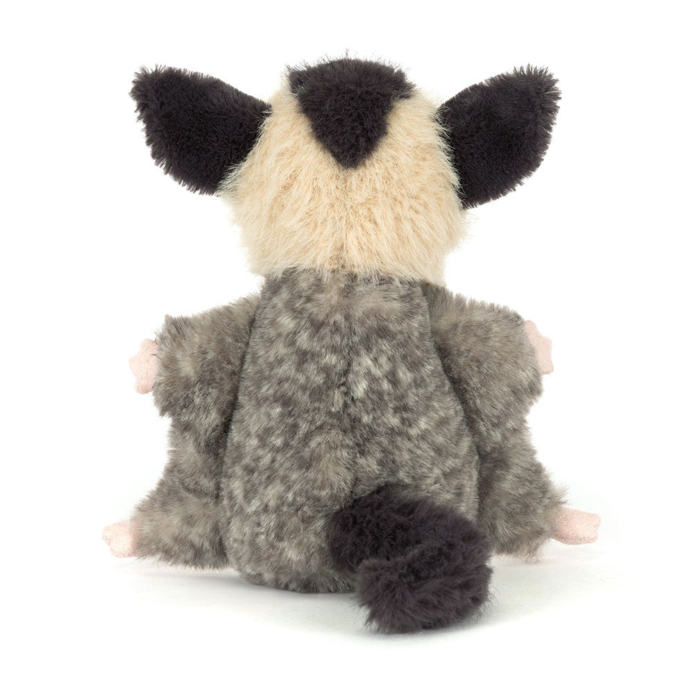 Plush toy raccoon on a white background