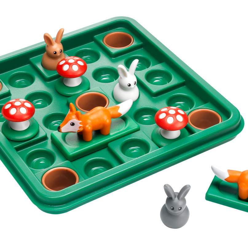 Toy puzzle with animal figures and mushrooms on a green tray