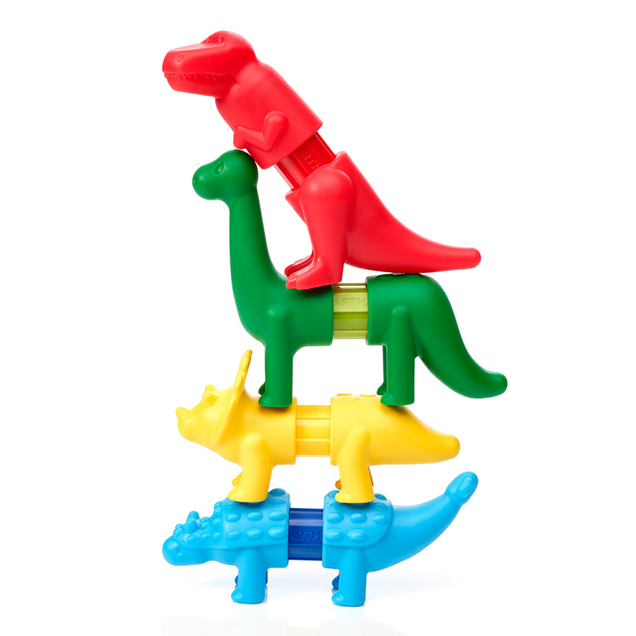 Stack of colorful dinosaur toys on a white background