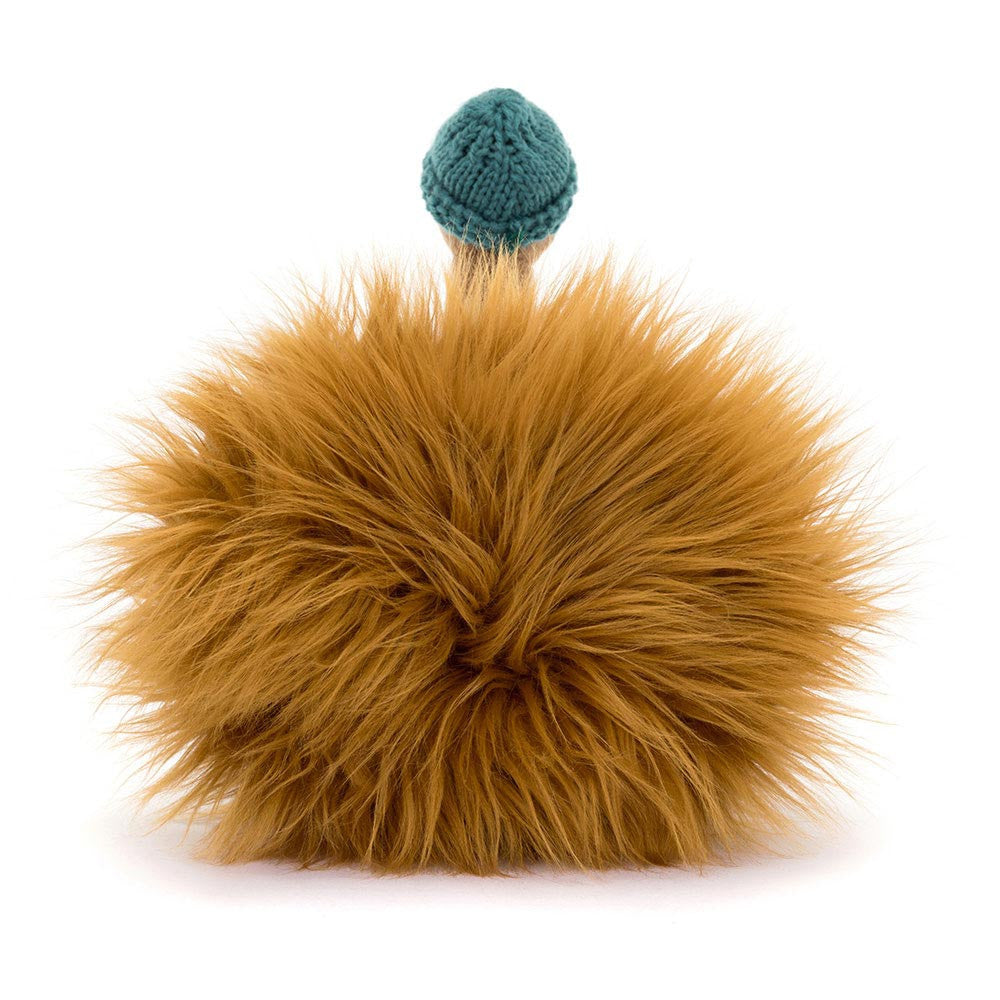 Furry brown ball with a teal top on a white background