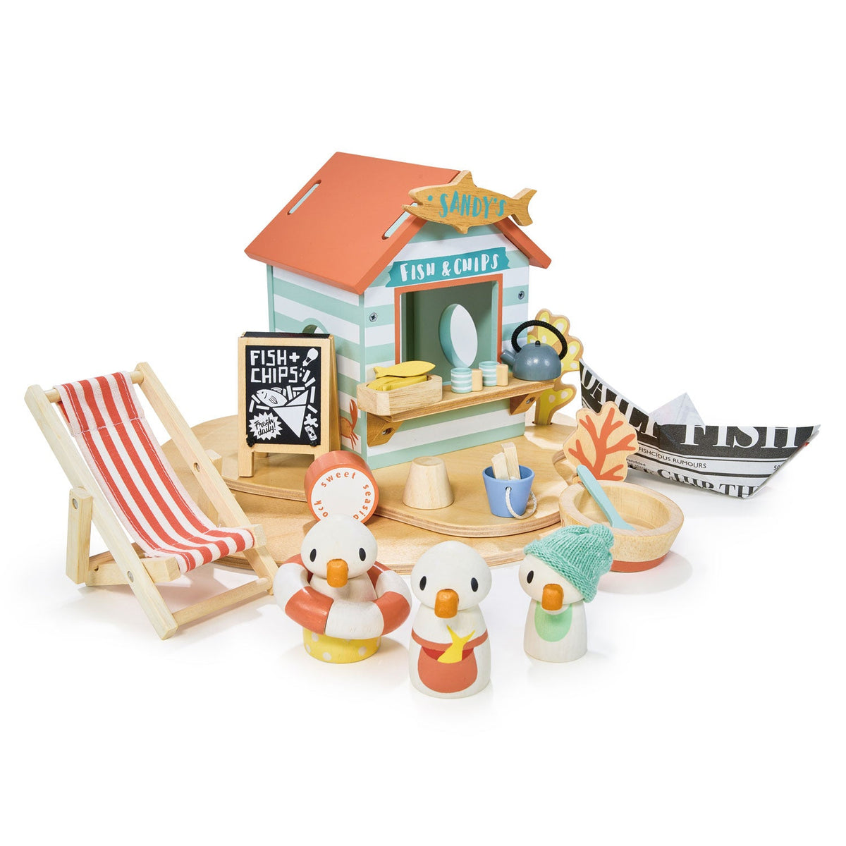 Toy set with a fish and chip shop, deck chair, and penguin figures on a white background