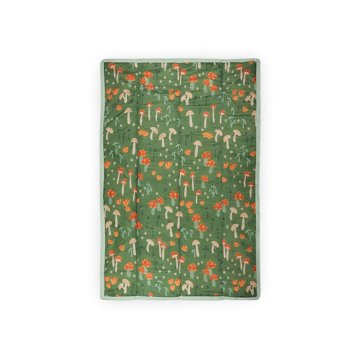 Green blanket with mushroom and flower pattern on a white background
