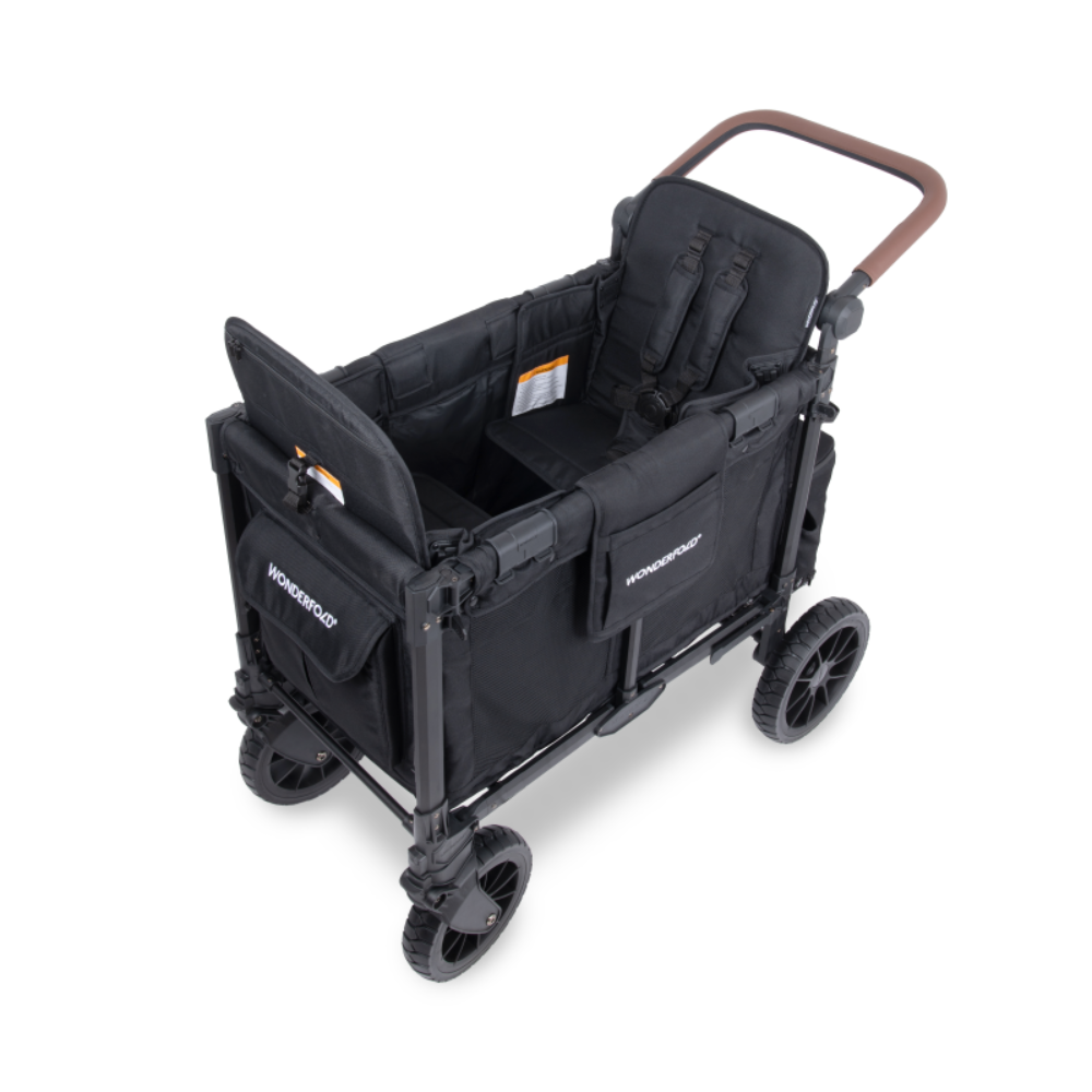 A black Wonderbug fold-down utility wagon stroller with a brown handlebar, shown from a three-quarters angle on a white background.