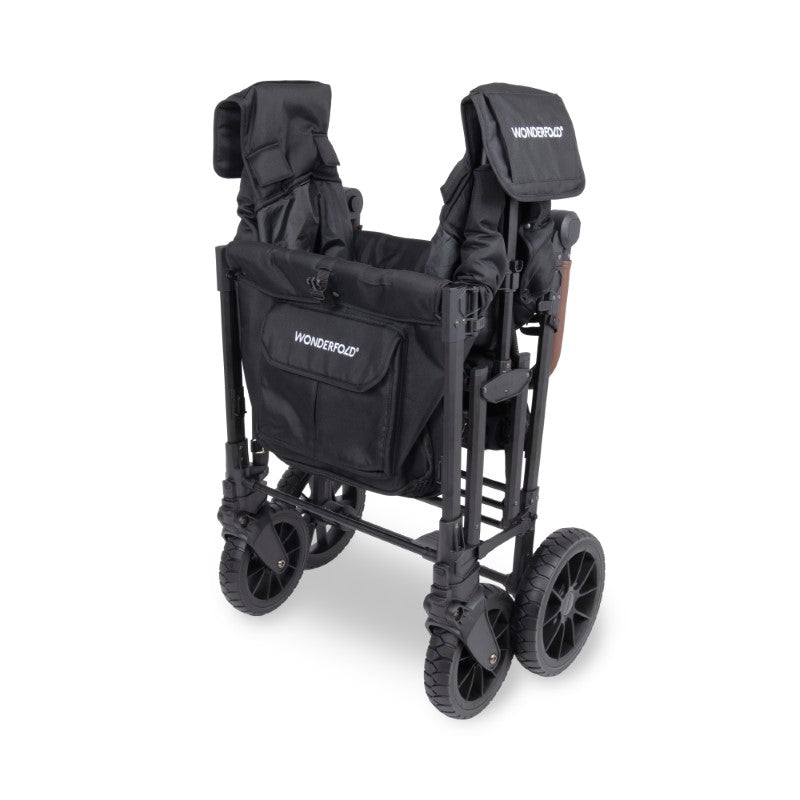 Black stroller with folded seat and bag on a white background
