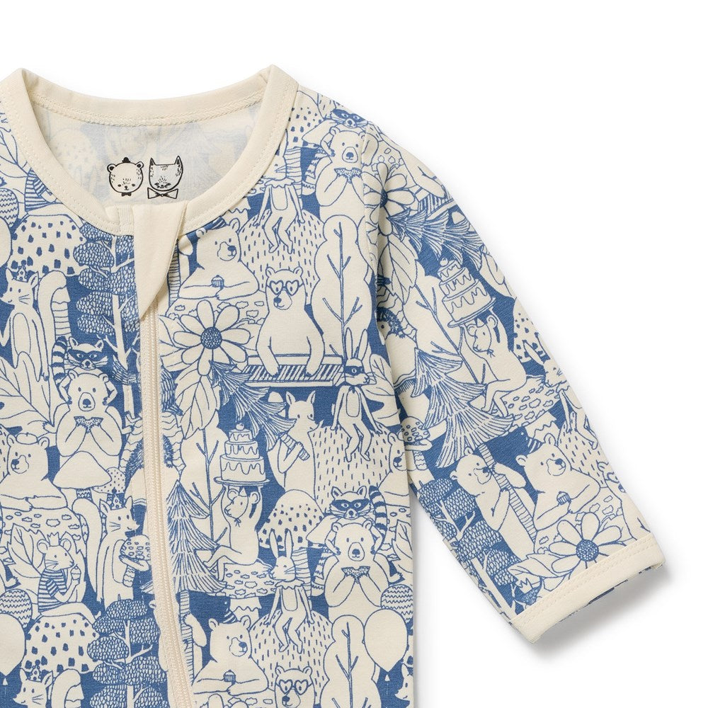Baby onesie with blue and white animal pattern on a white background