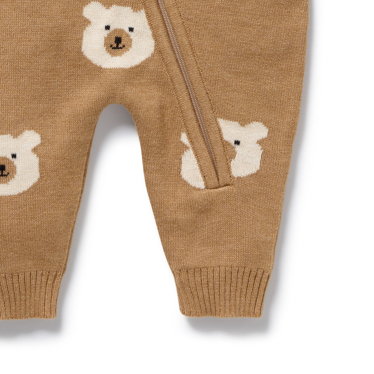 Brown knitted baby pants with bear face patterns on a white background