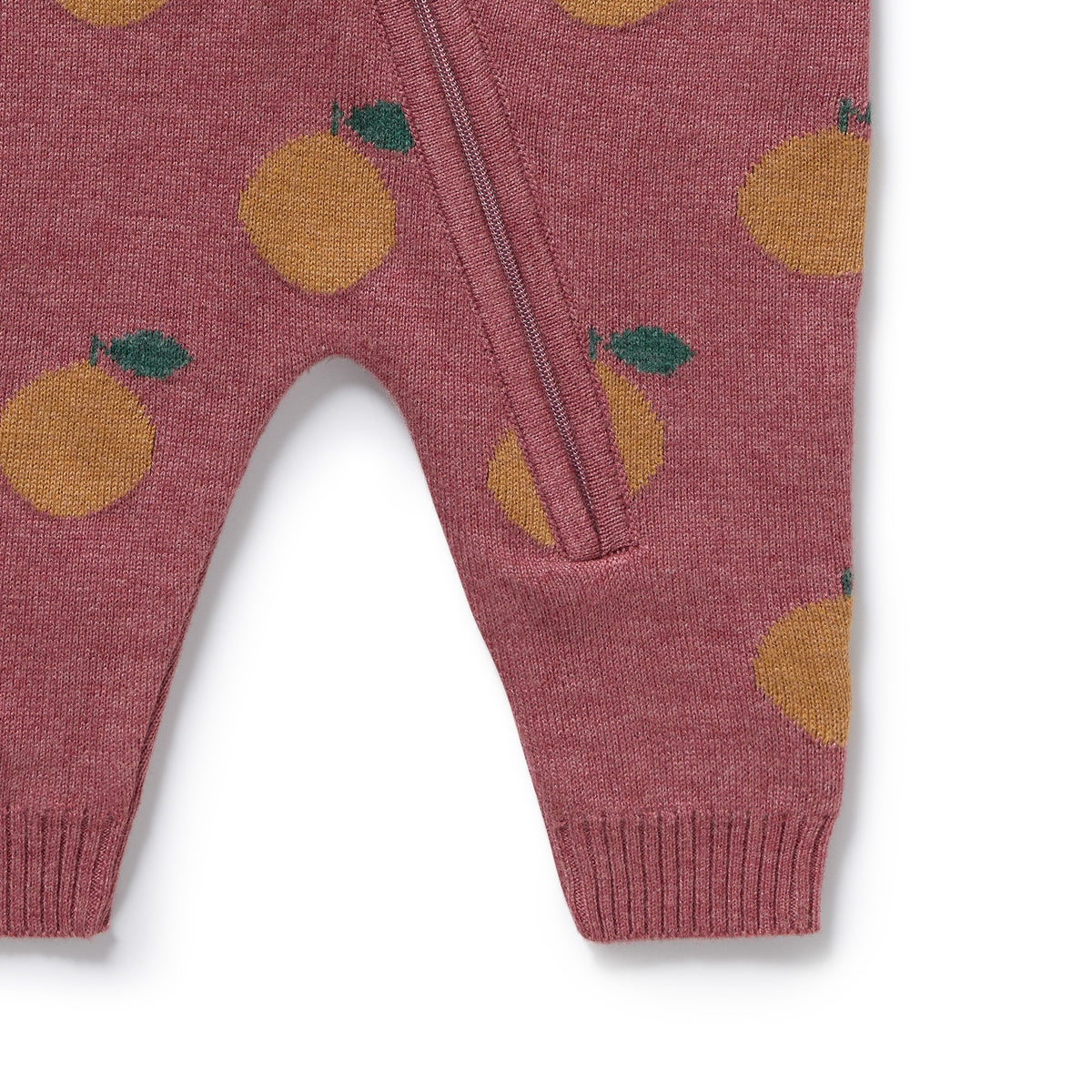Pink baby romper with orange and green pattern on a white background