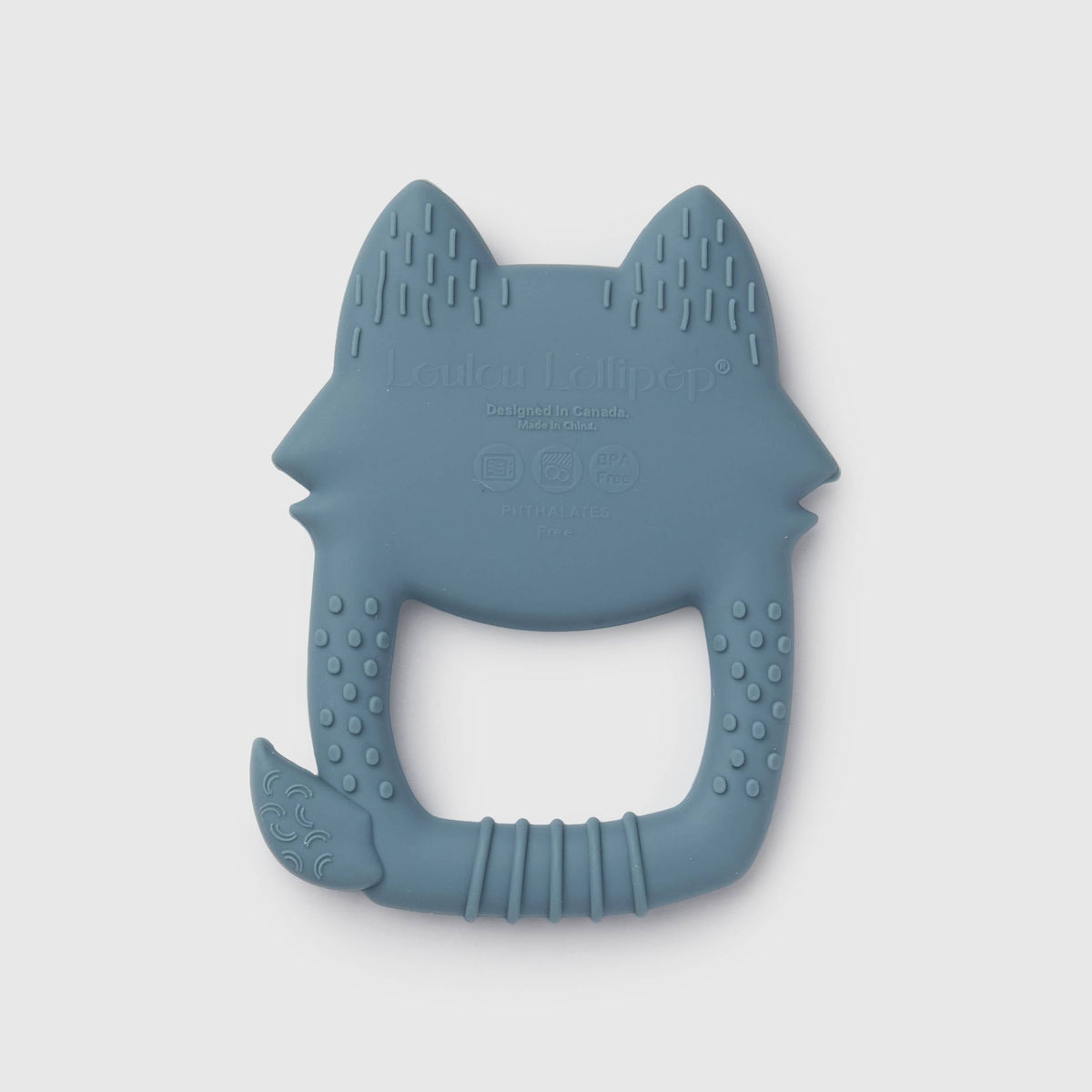 A blue-gray silicone baby teether shaped like a fox head, featuring textured ridges and a handle, shown on a light gray background.