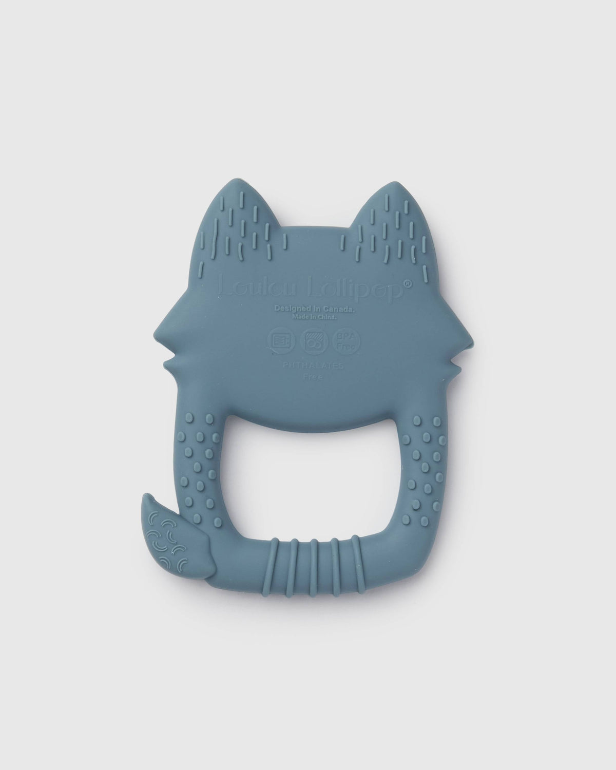 A blue-gray silicone baby teether shaped like a fox head, featuring textured ridges and a handle, shown on a light gray background.