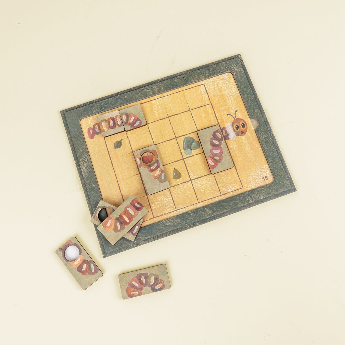 Board game with caterpillar and butterfly cards on a beige background