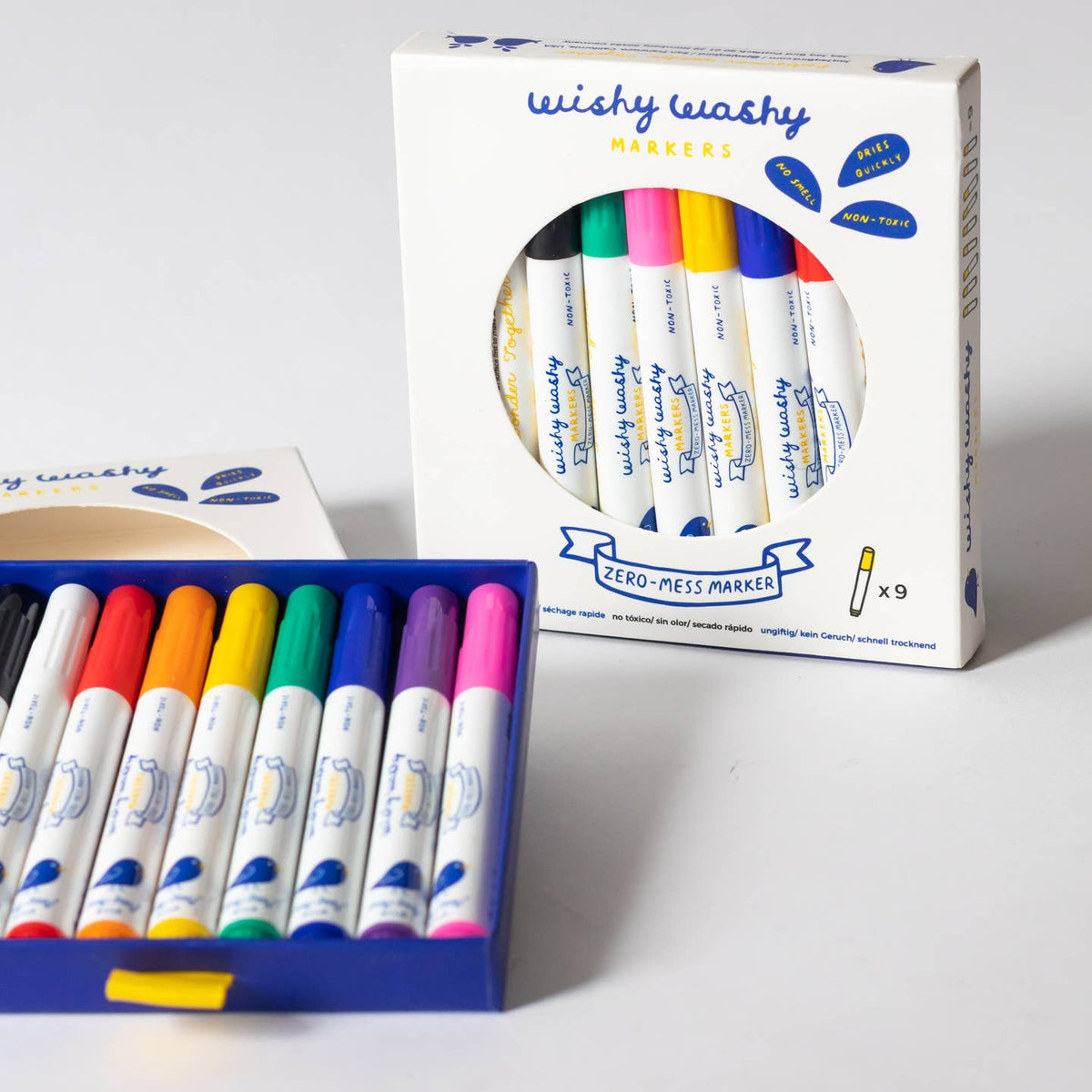 Box of Wishy Washy markers with colorful markers displayed in front on a white background