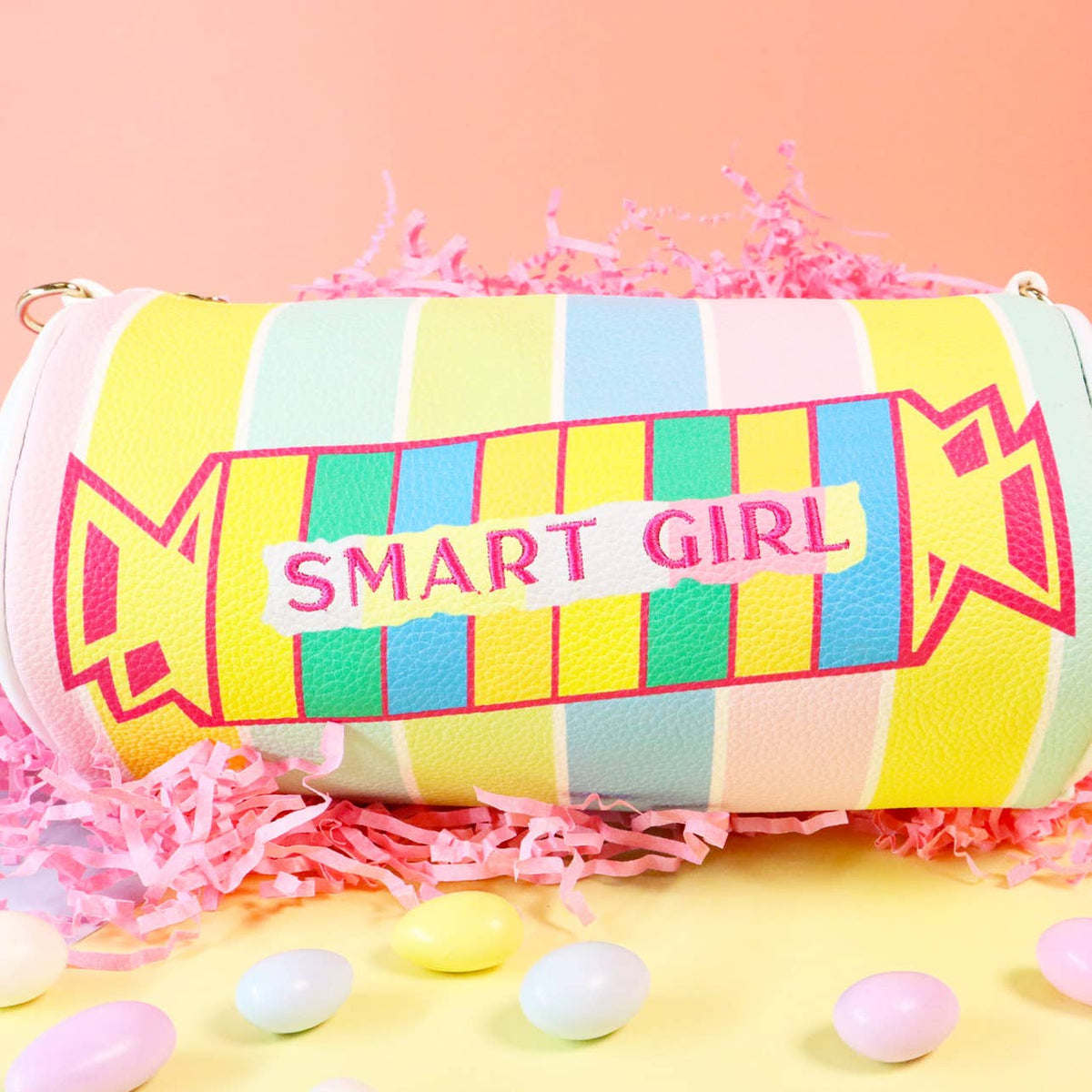 Colorful striped pouch with 'SMART GIRL' text on a pink background