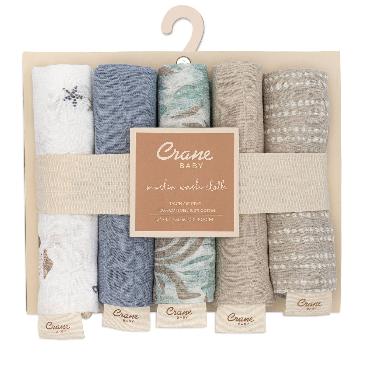 Pack of five baby muslin wash cloths with a 'Crane Baby' label on a beige hanger.