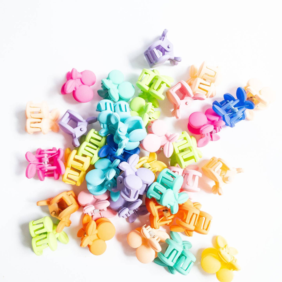 Assorted colorful hair clips on a white background