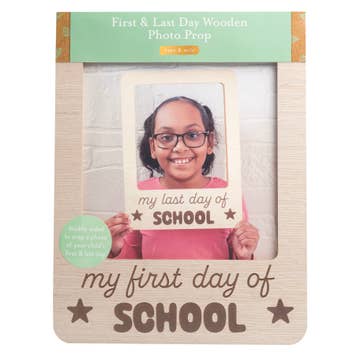 Wooden photo prop frame with 'First & Last Day of School' text and a photo of a child holding a sign.