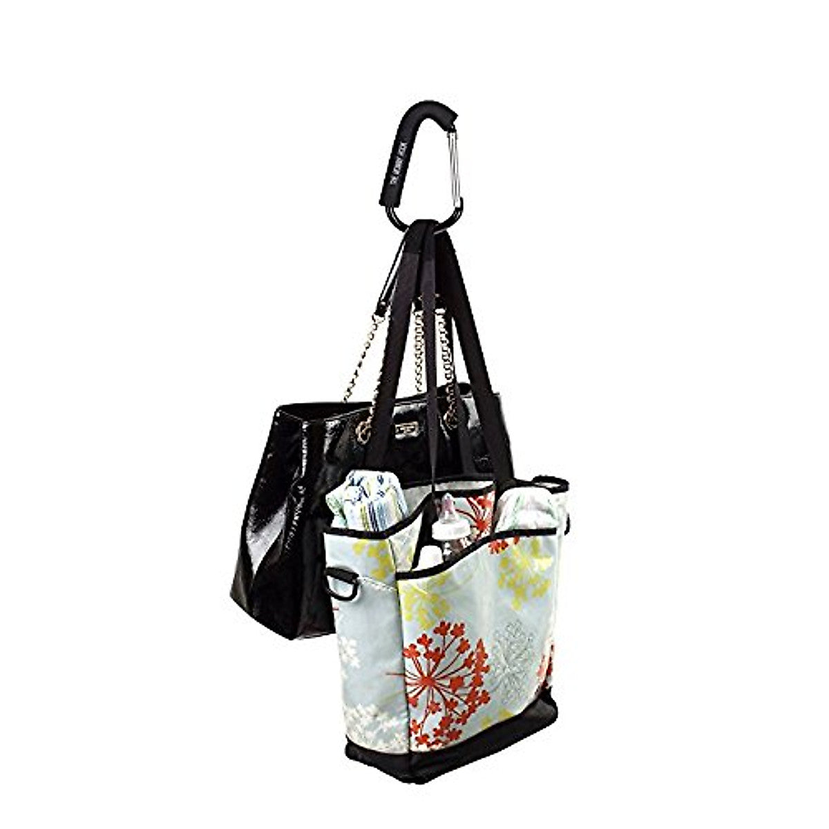Black handbag with a floral tote attached on a white background