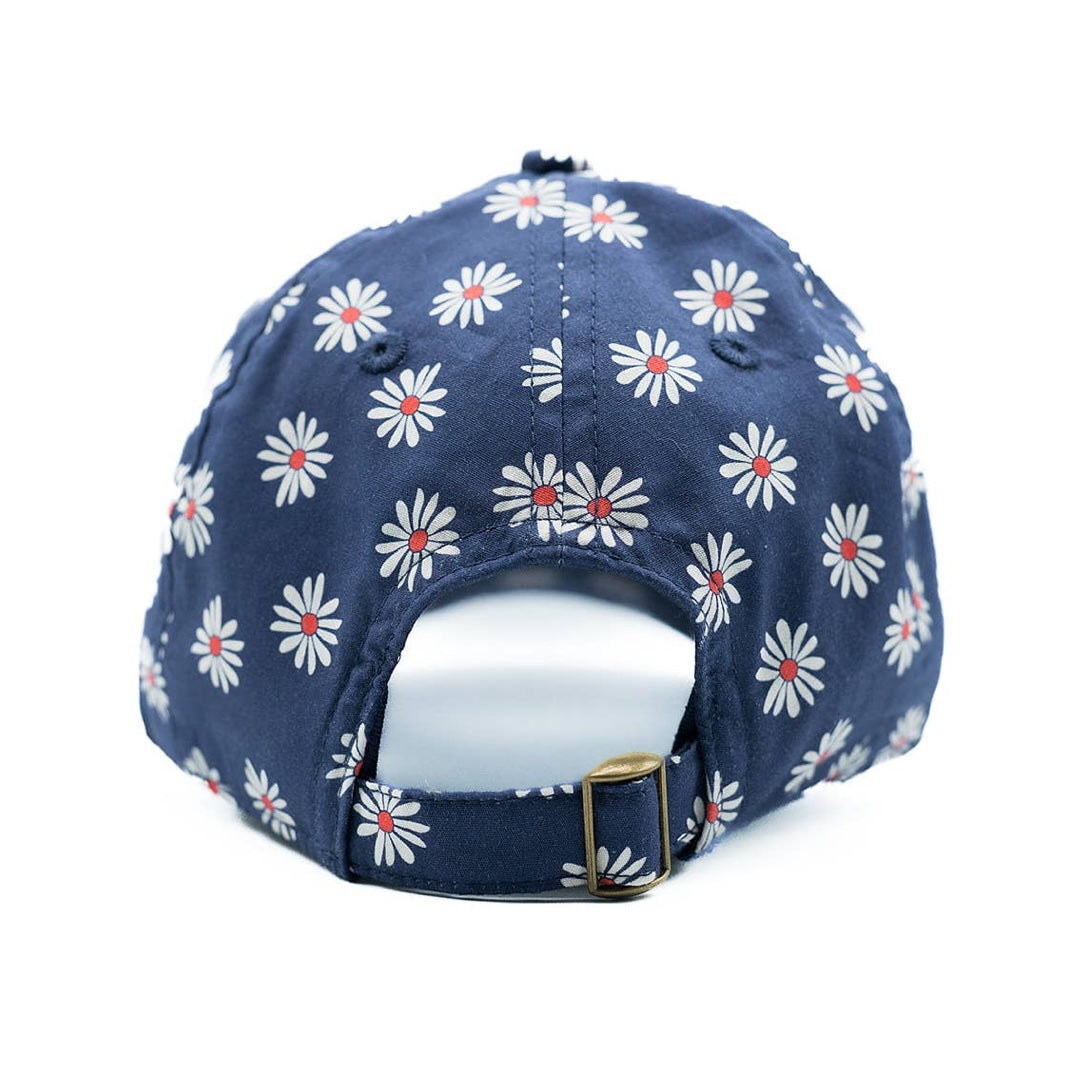 Navy blue cap with white floral pattern on a white background