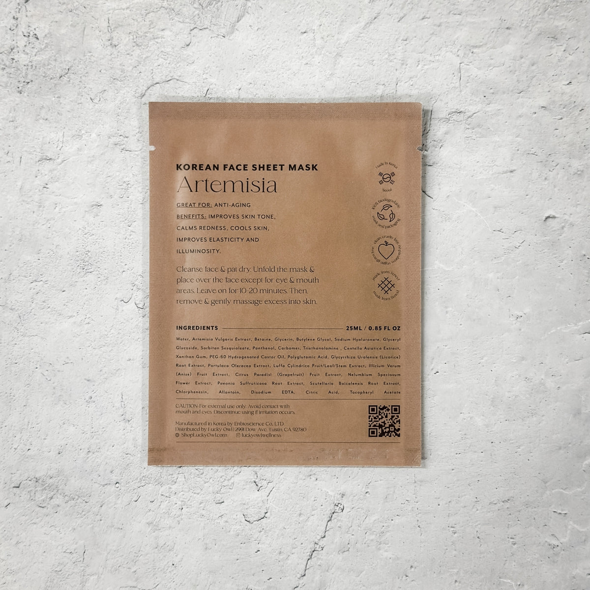 Korean face sheet mask packaging with text and a QR code on a textured white background
