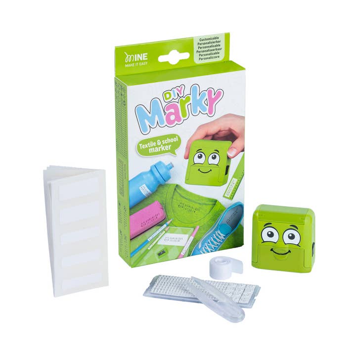 Green 'Do Marky' textile and school marker packaging with accessories on a white background