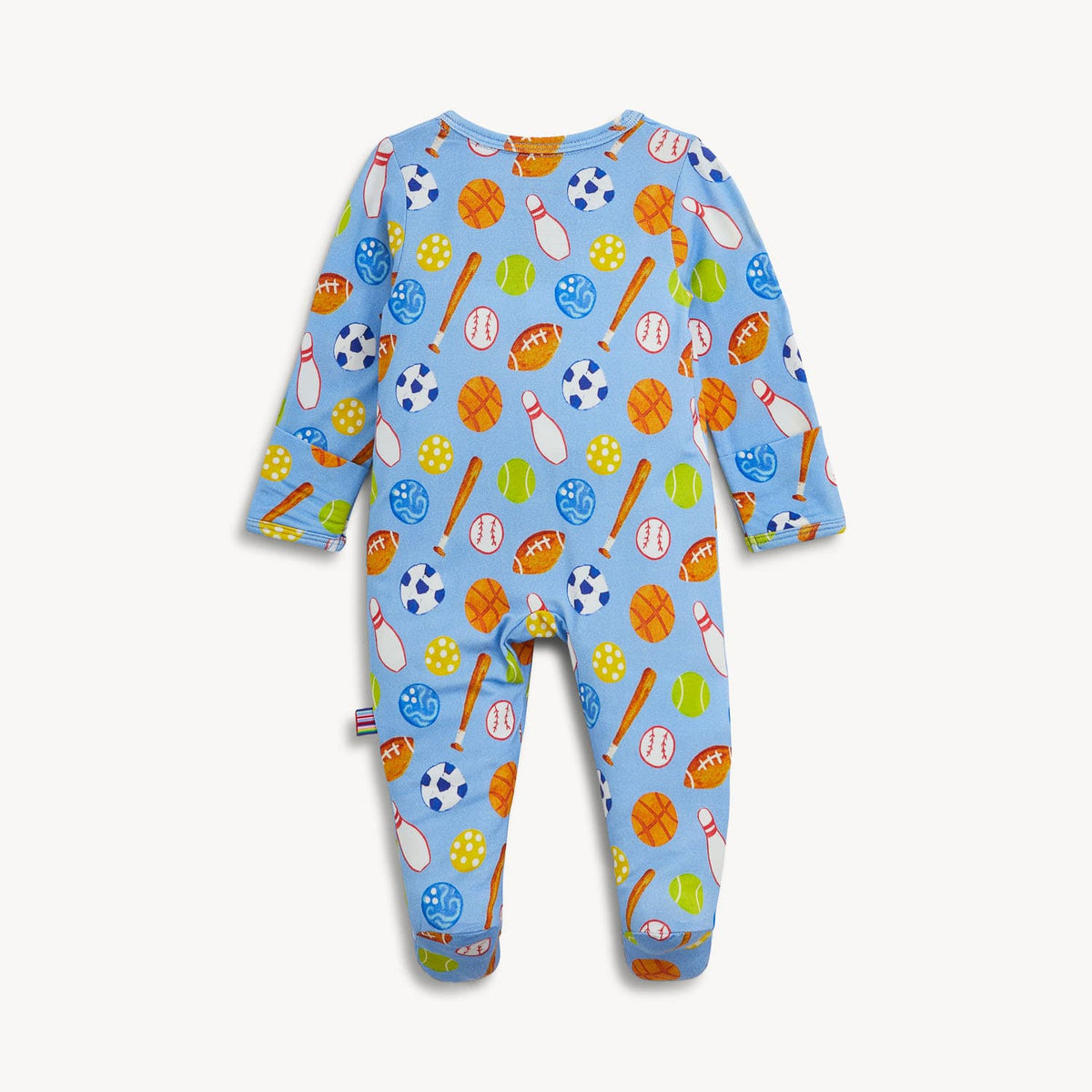 A baby long-sleeve footed sleeper in light blue, featuring an all-over sports-themed print with baseballs, footballs, basketballs, bats, and soccer balls, shown flat against a light off-white background.