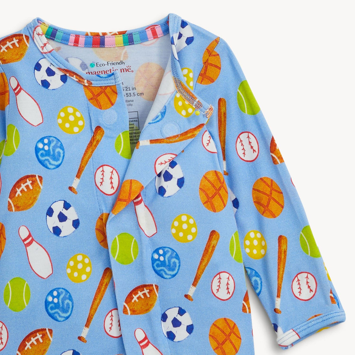 Children's outfit with sports-themed pattern on a light blue background