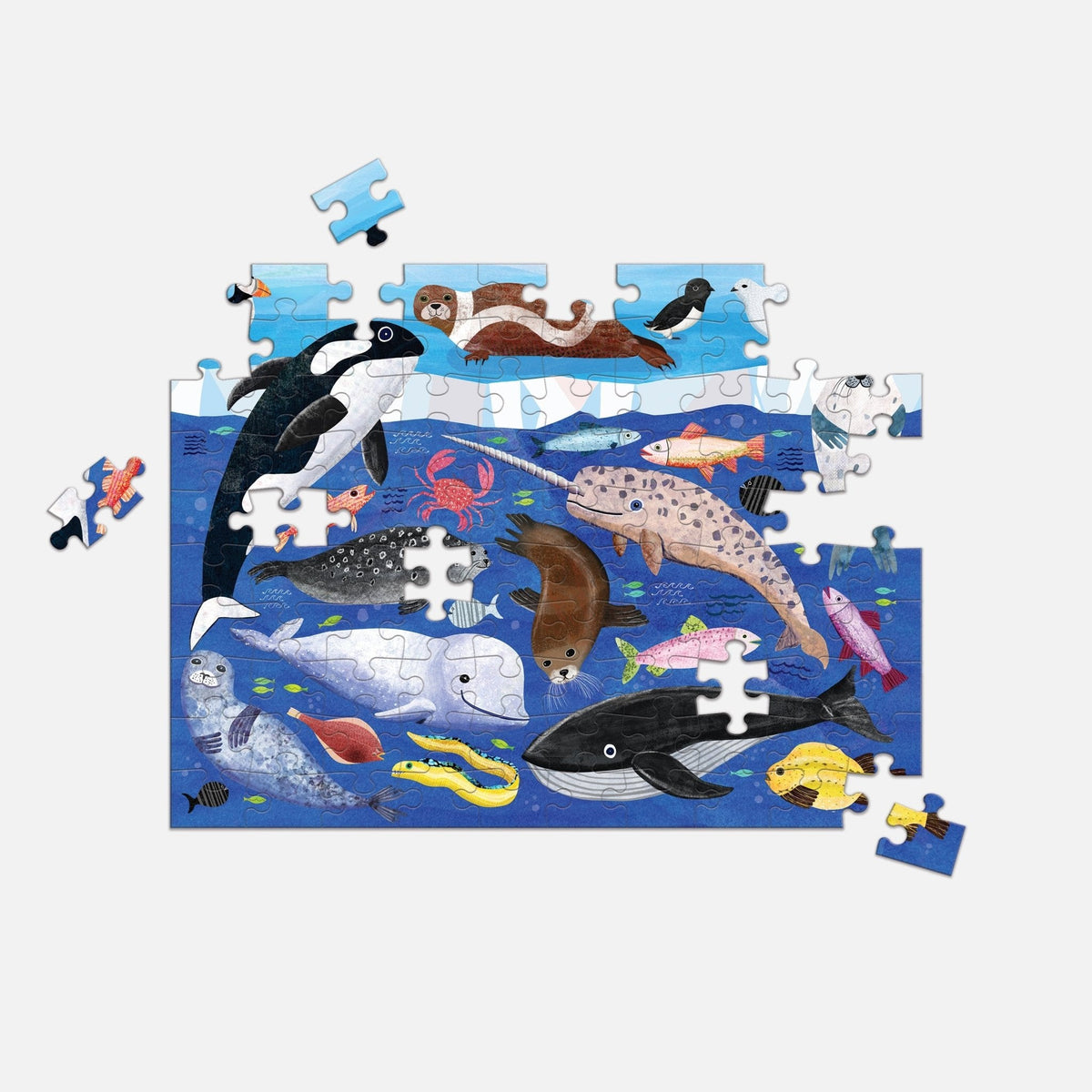In-progress Mudpuppy Arctic Above & Below 100 Piece Double-Sided Puzzle showing an illustrated underwater arctic scene with a killer whale, narwhal, beluga whale, seals, fish, and other marine life.