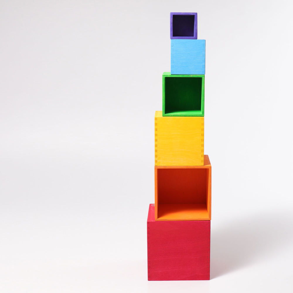 Stack of colorful square blocks on a white background