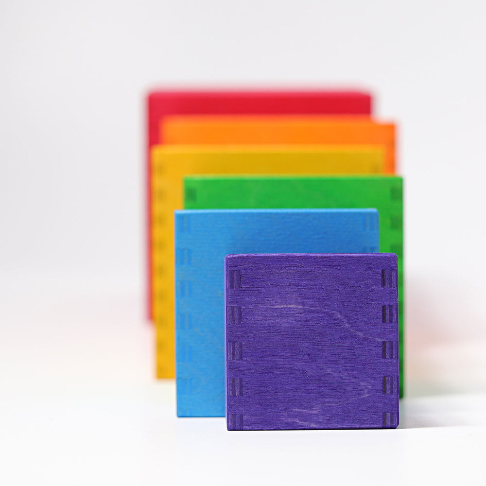 Set of colorful notebooks stacked on a white background