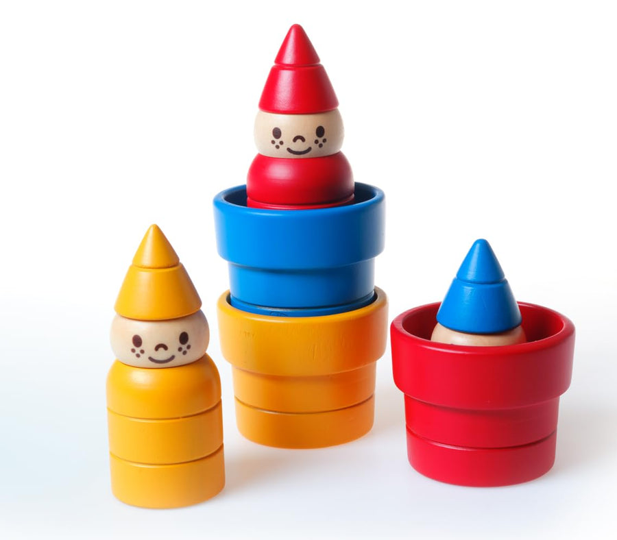 Colorful stackable toy figures with cone-shaped hats on a white background