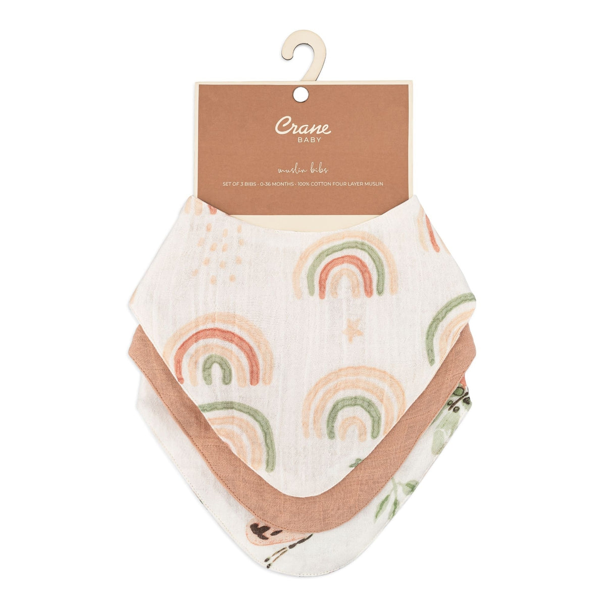 A white muslin baby bib featuring a repeating pattern of pastel rainbow arches in peach, green, and orange, shown on a solid white background.