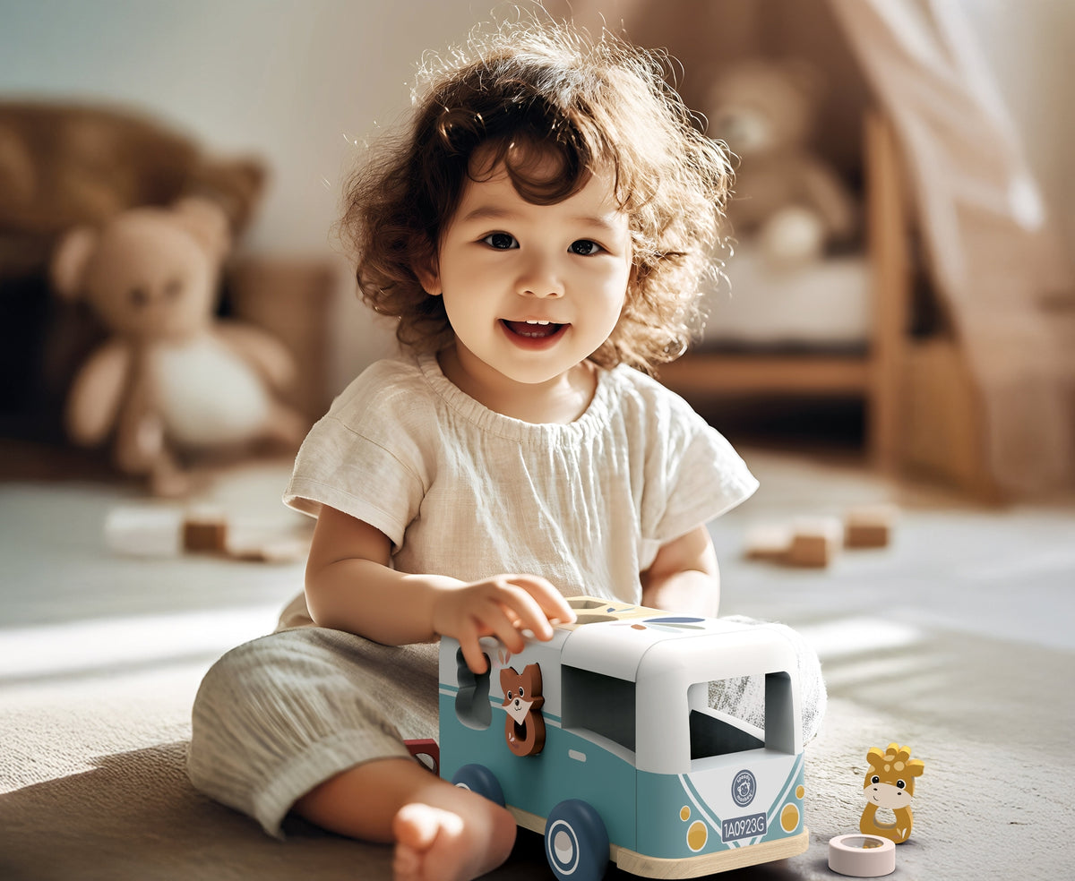 Child playing with a toy camper in a cozy room