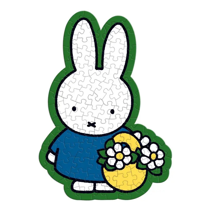 Jigsaw puzzle shaped like a cartoon rabbit holding flowers on a white background