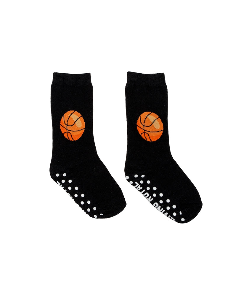 Black socks with orange basketball graphics and white sole patterns on a white background