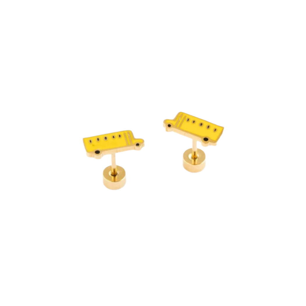 Two yellow guitar bridge components on a white background