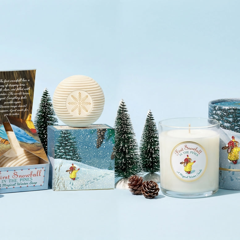 Collection of candles and packaging on a light blue background with decorative trees.